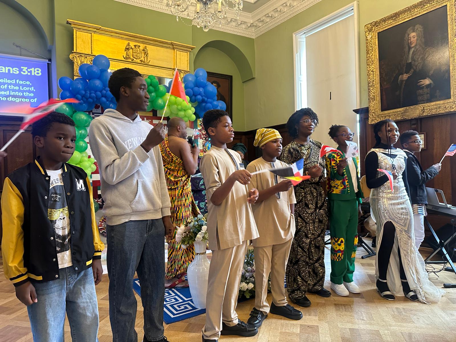 Youth holding flags during a colourful ministry event