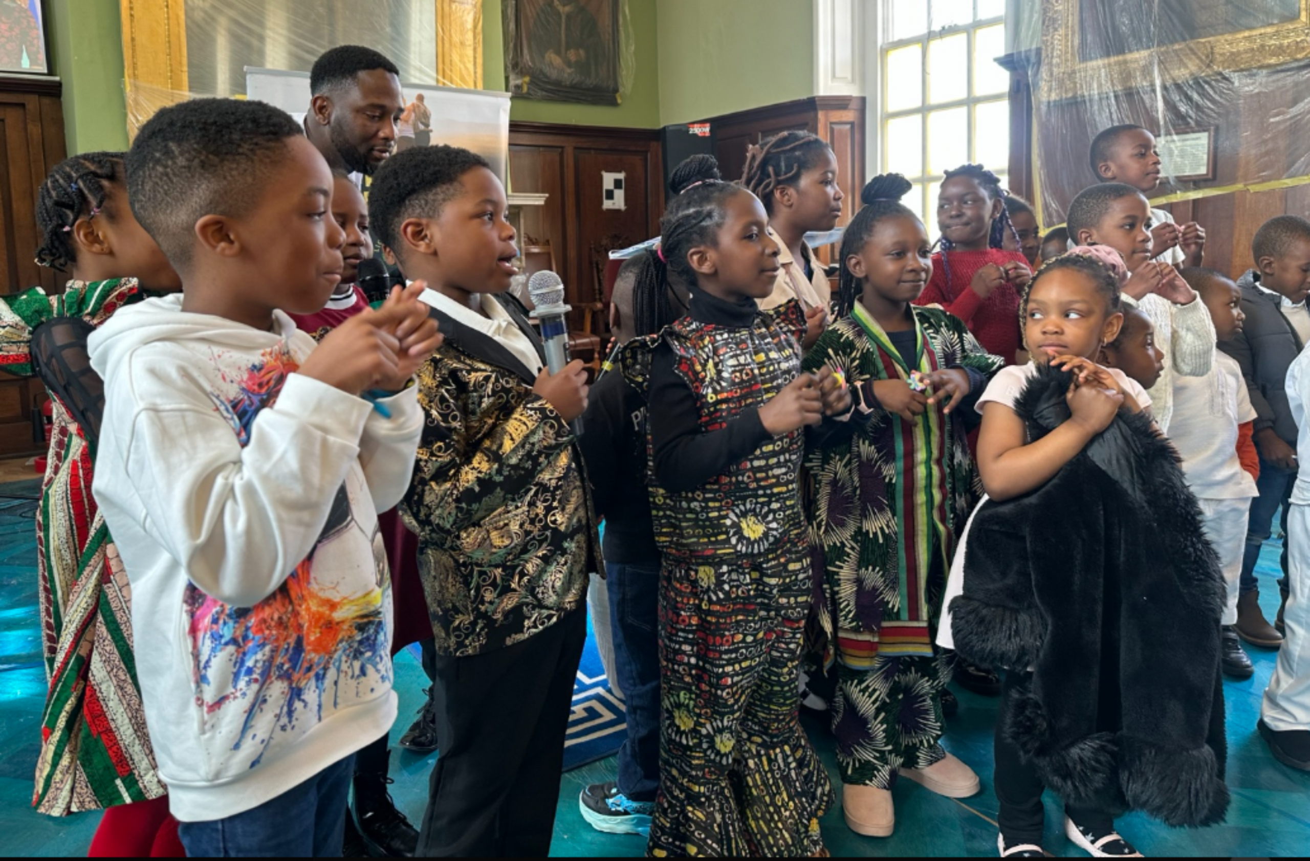 Children singing during a ministry presentation